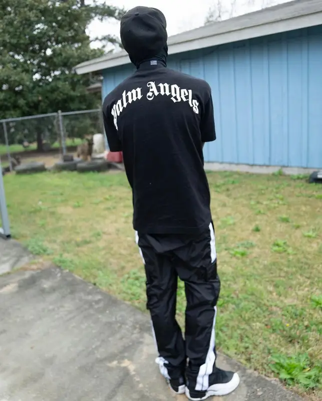 Quando Rondo outfit in Palm Angels, Jordan, and New Era, 2022