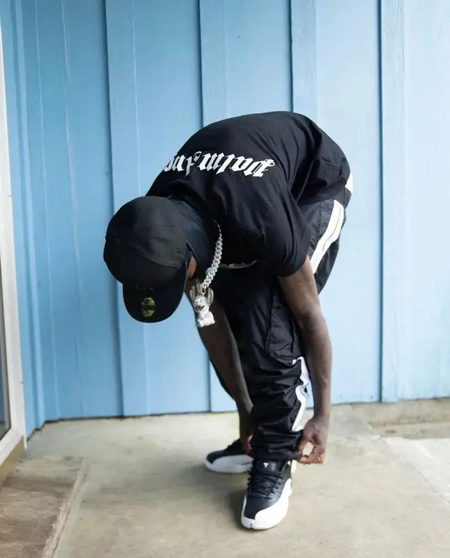 Quando Rondo outfit in Palm Angels, Jordan, and New Era, 2022