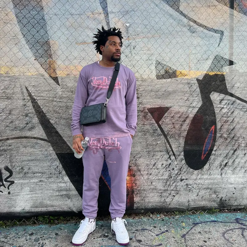 ASAP Ant outfit in Von Dutch, Louis Vuitton, and Young Thug Merch, 2022