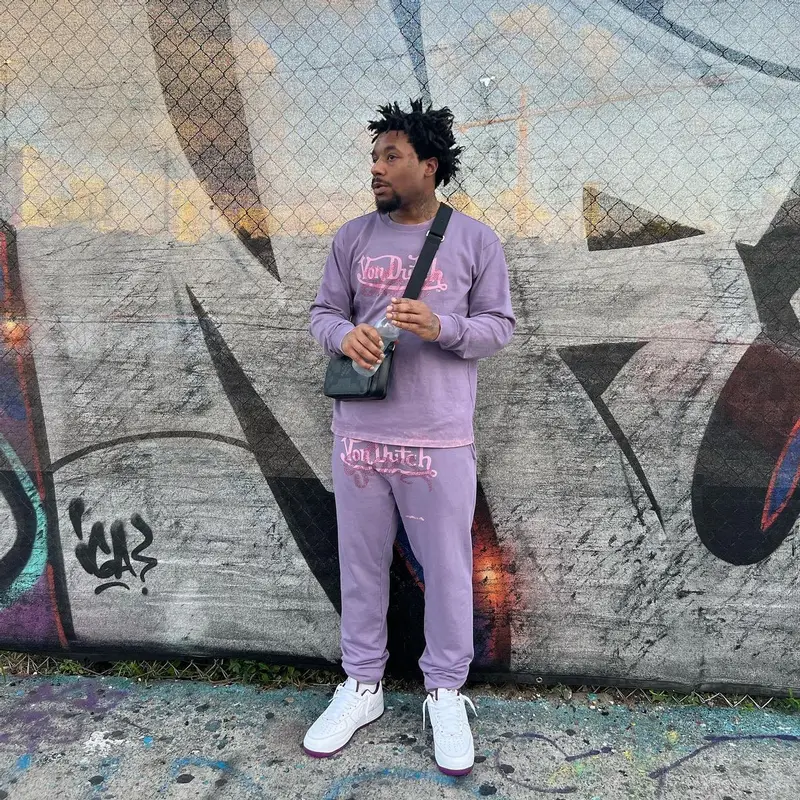 ASAP Ant outfit in Von Dutch, Louis Vuitton, and Young Thug Merch, 2022