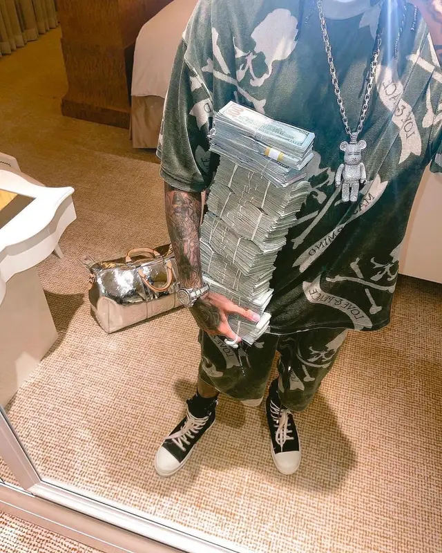 Tyga outfit in Rick Owens, Louis Vuitton, and Mastermind, 2022