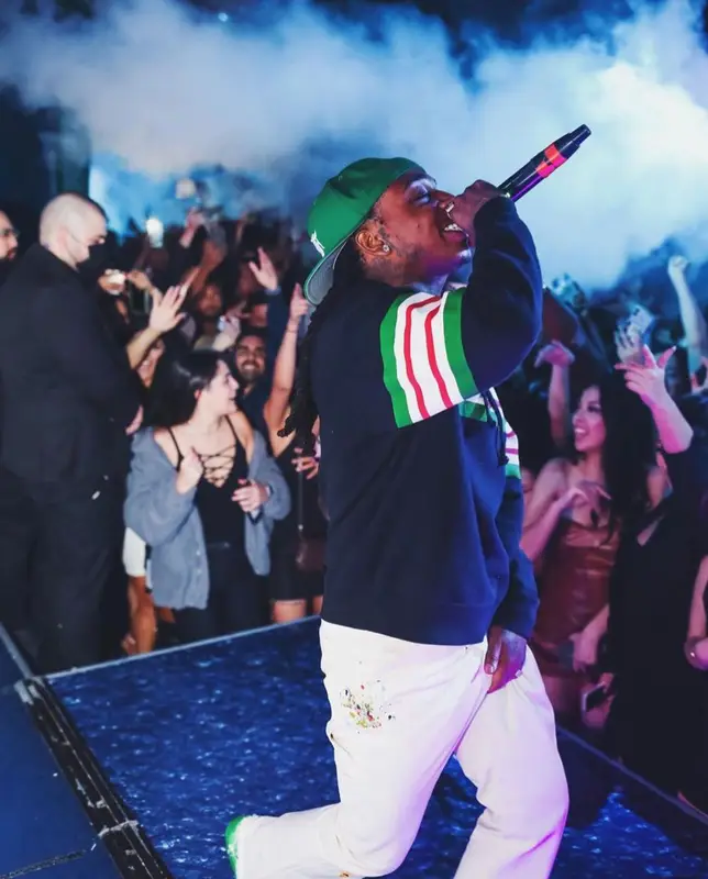 Jacquees outfit in Gucci, Fear of God, and New Era, 2022