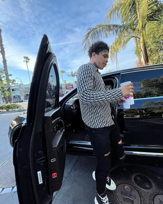 K Suave outfit in Dior, Amiri, and Fanta, 2022