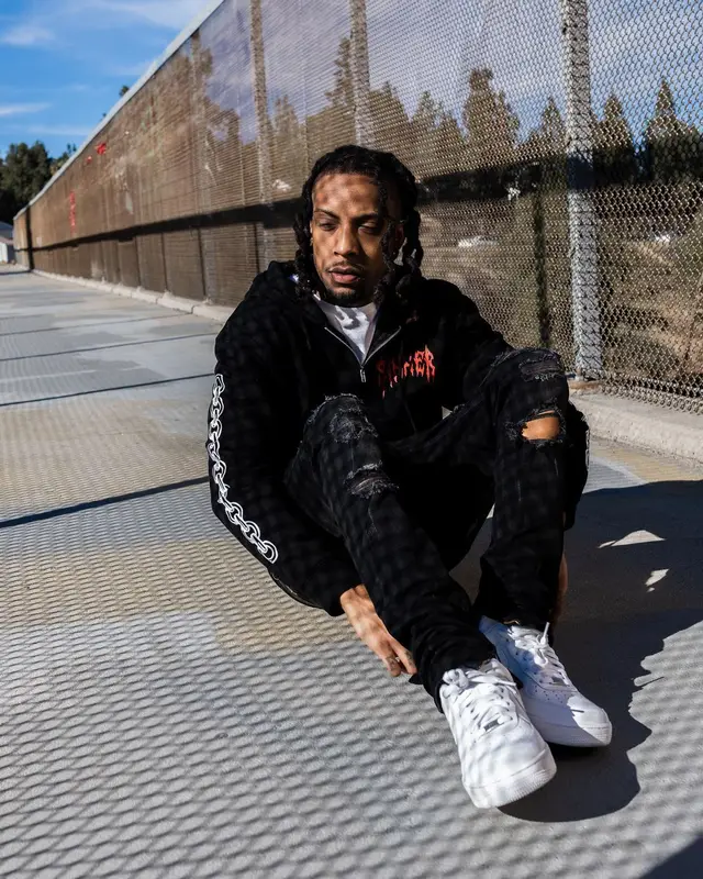 Chris Travis outfit in FashionNova and Nike, 2022