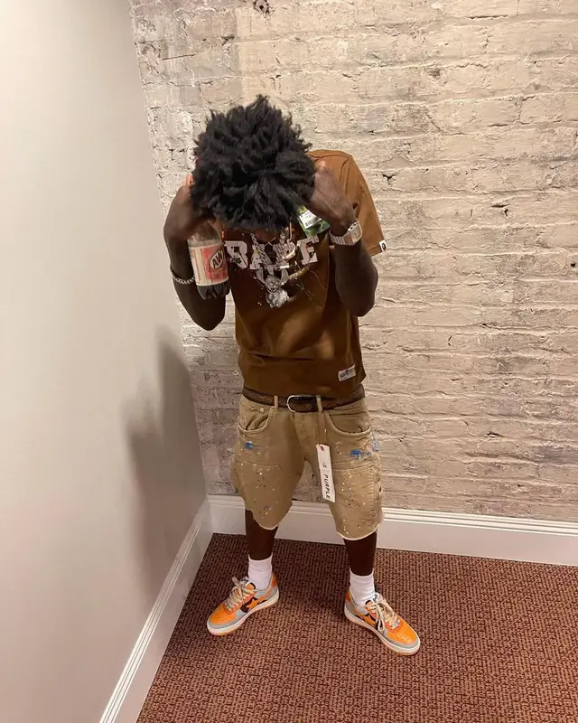 Quando Rondo outfit in Bape, Purple Brand, and Polo Ralph Lauren, 2022