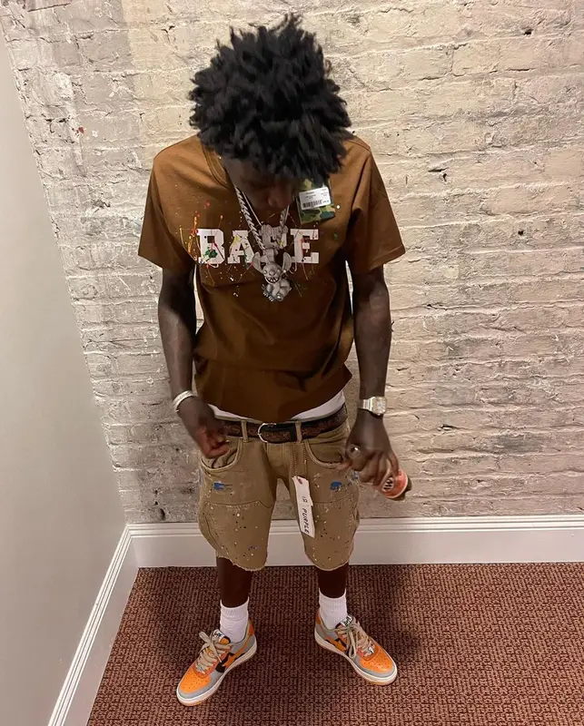 Quando Rondo outfit in Bape, Purple Brand, and Polo Ralph Lauren, 2022
