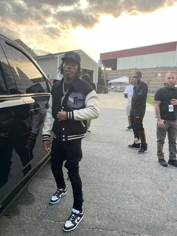 Lil Baby outfit in Amiri, Supreme, and New Era, 2021