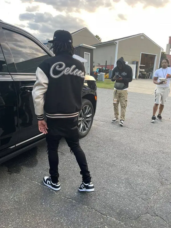 Lil Baby outfit in Amiri, Supreme, and New Era, 2021