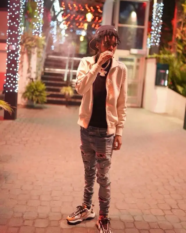 Lil Poppa outfit in Palm Angels and Amiri, 2022