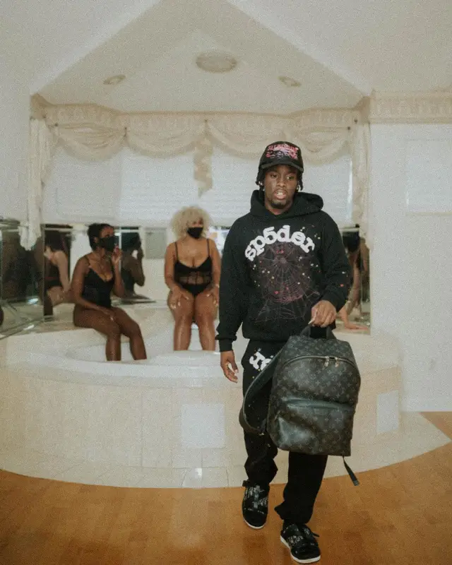 Kai Cenat outfit in Louis Vuitton, Young Thug Merch, and Spider Worldwide, 2021