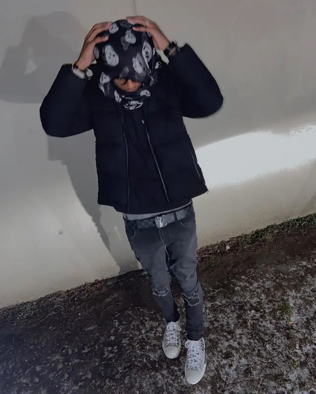 Lil Benny outfit in Chrome Hearts, Louis Vuitton, and Alexander McQueen, 2022
