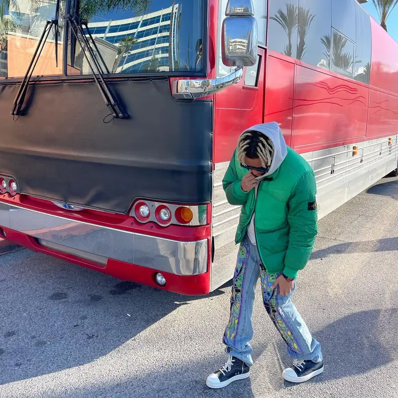 Cordae outfit in Stone Island, Who Decides War, and Louis Vuitton, 2022