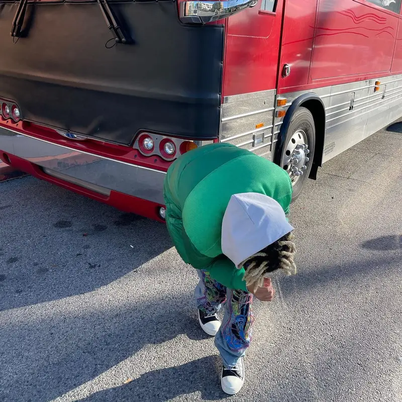 Cordae outfit in Stone Island, Who Decides War, and Louis Vuitton, 2022