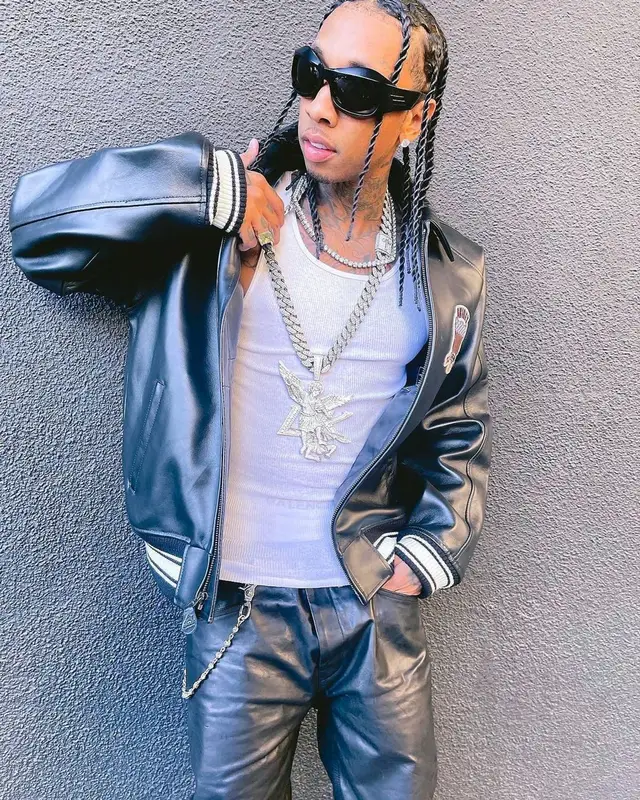 Tyga outfit in Avirex, Nyrva, and Bottega Veneta, 2022