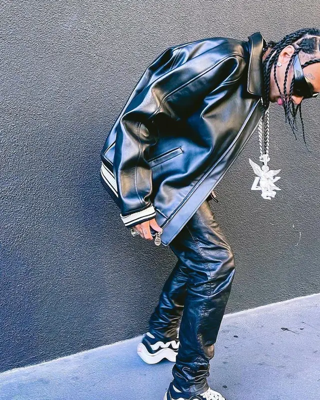 Tyga outfit in Avirex, Nyrva, and Bottega Veneta, 2022