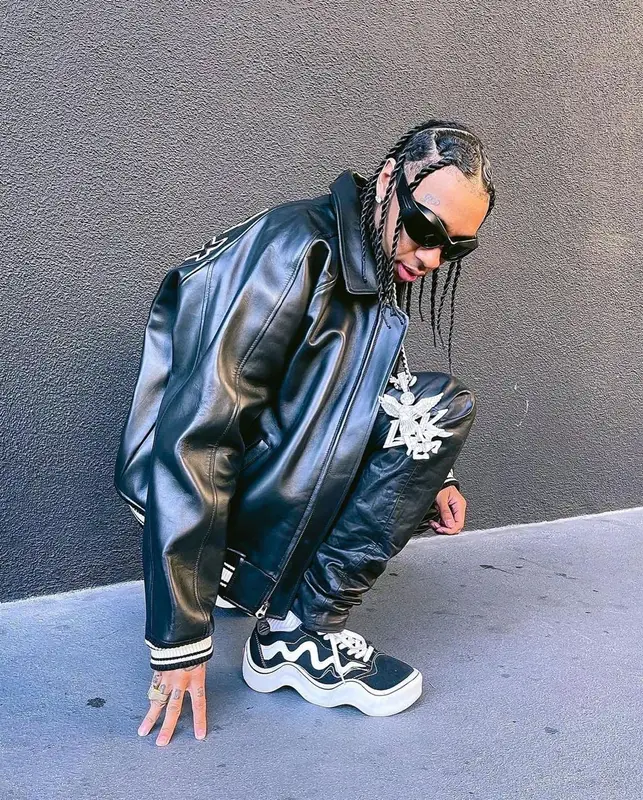 Tyga outfit in Avirex, Nyrva, and Bottega Veneta, 2022