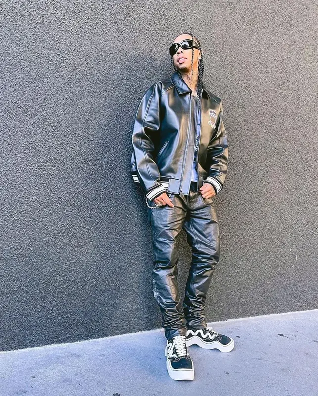 Tyga outfit in Avirex, Nyrva, and Bottega Veneta, 2022