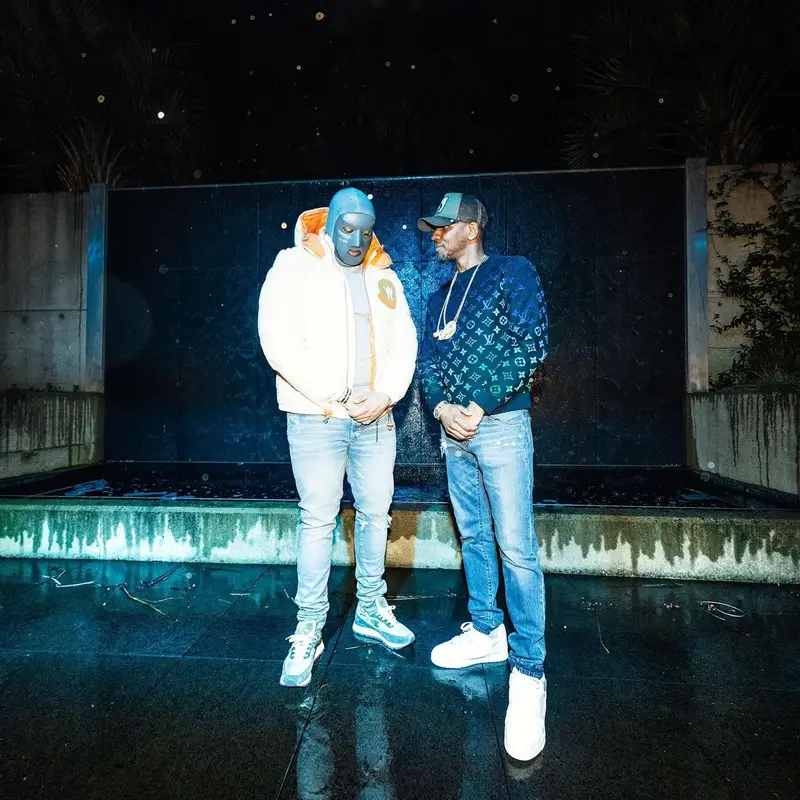 M Huncho outfit in Moncler, Amiri, and Louis Vuitton, 2022