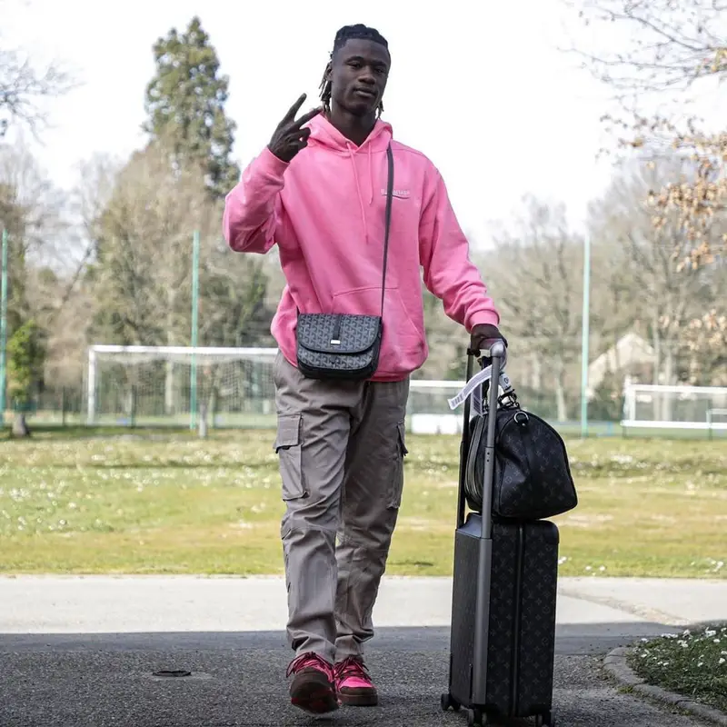 Eduardo Camavinga outfit in Balenciaga, Louis Vuitton, and Goyard, 2022