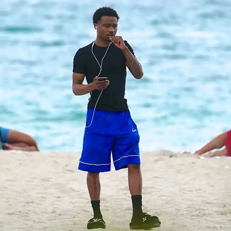 Roddy Ricch outfit in Polo Ralph Lauren, Nike, and Louis Vuitton, 2022