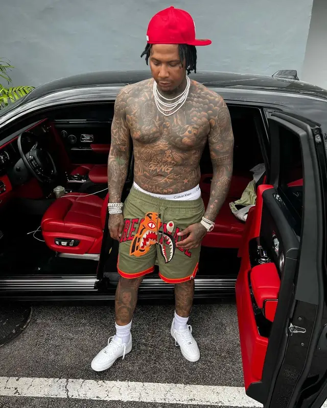 Moneybagg Yo outfit in Bape, New Era, and Readymade, 2022