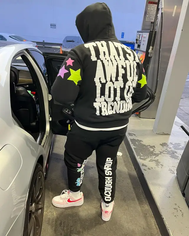 Peezy outfit in Awful Lot of Cough Syrup, Nike, and Coi Leray Merch, 2022