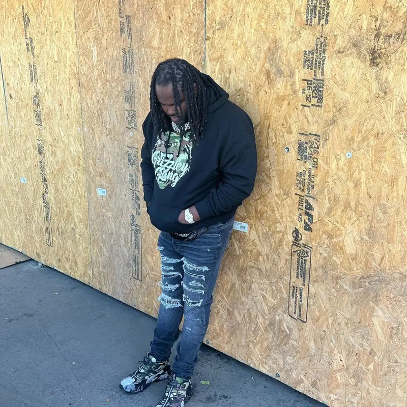 Tee Grizzley outfit in Amiri, Burberry, and Saint Laurent, 2022