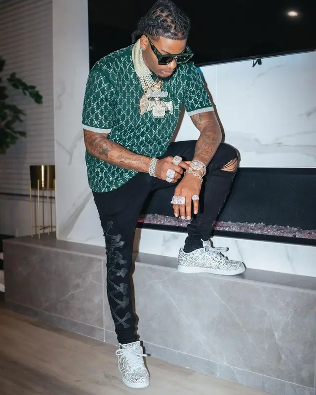 CJ So Cool outfit in Gucci, Amiri, and Louis Vuitton, 2022