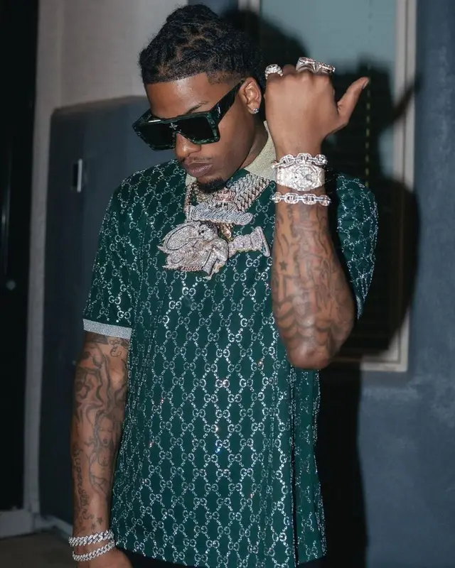CJ So Cool outfit in Gucci, Amiri, and Louis Vuitton, 2022