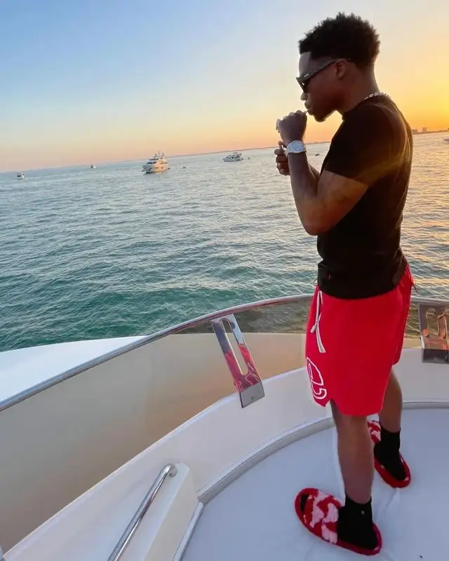 Roddy Ricch outfit in Polo Ralph Lauren, Rhude, and Bottega Veneta, 2022