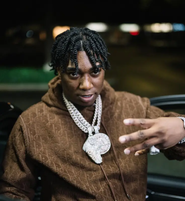 Fredo Bang outfit in Dior, Amiri, and Supreme, 2022