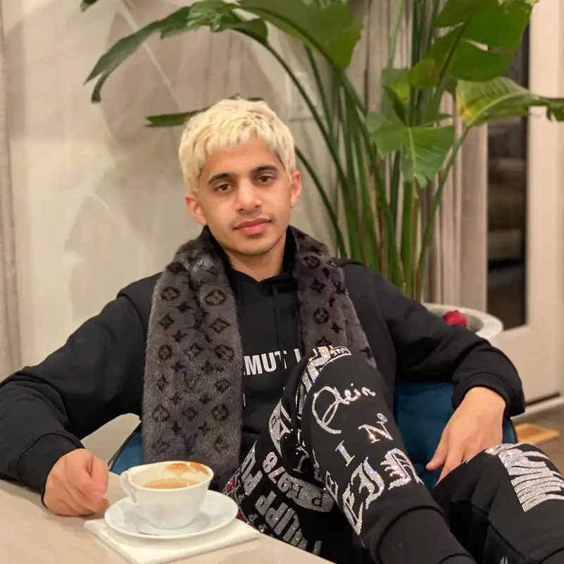 Zahir outfit in Helmut Lang, Philipp Plein, and Louis Vuitton, 2021
