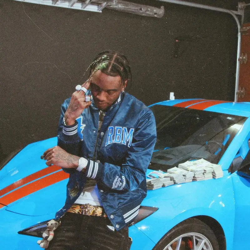 Soulja Boy outfit in Amiri, Versace, and Burberry, 2022