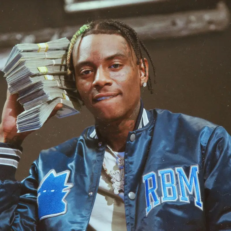 Soulja Boy outfit in Amiri, Versace, and Burberry, 2022