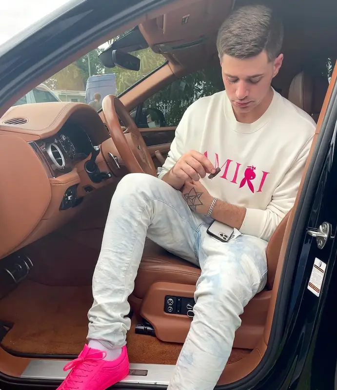 ItsWill outfit in Amiri, Purple Brand, and Playboy, 2021