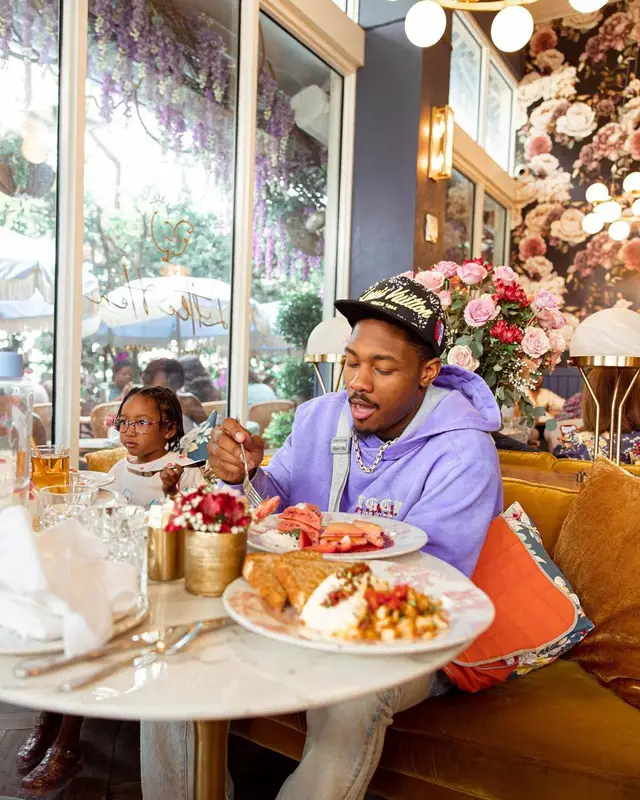 Stefon Diggs outfit in Amiri, Chanel, and Louis Vuitton, 2022