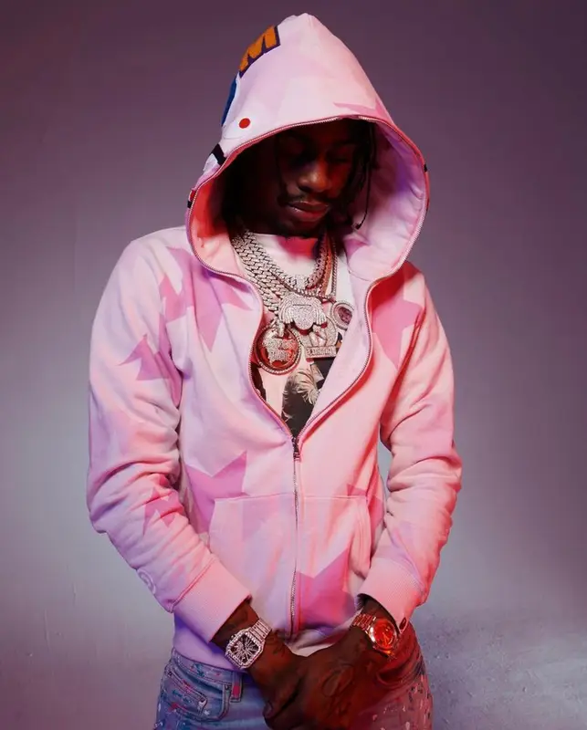 Russ Millions outfit in Places + Faces, Bape, and Amiri, 2022
