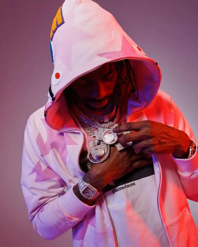 Russ Millions outfit in Places + Faces, Bape, and Amiri, 2022