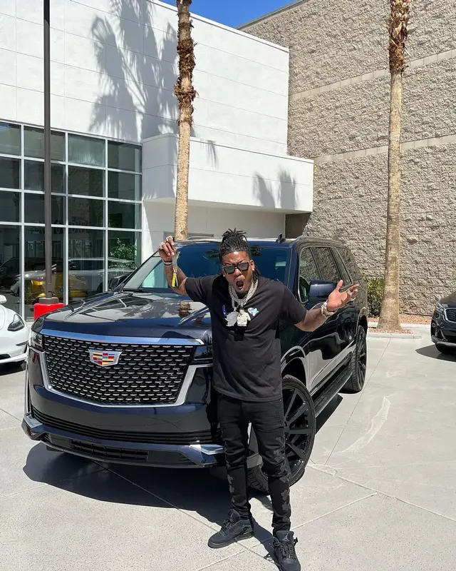 CJ So Cool outfit in Dior, Amiri, and Louis Vuitton, 2022