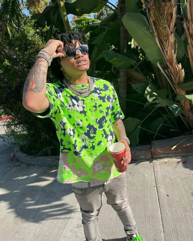 No Cap outfit in Dior, Louis Vuitton, and Balenciaga, 2022