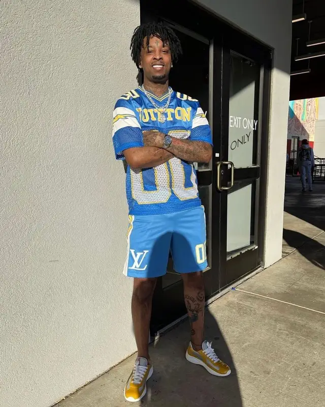 21 Savage outfit in Louis Vuitton and Prada, 2022