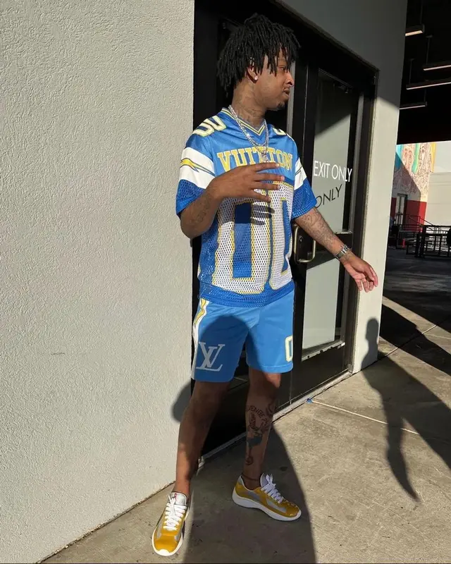 21 Savage outfit in Louis Vuitton and Prada, 2022