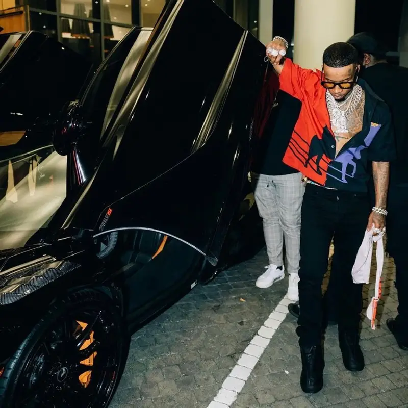 Tory Lanez outfit in Prada, Amiri, and Rhude, 2022