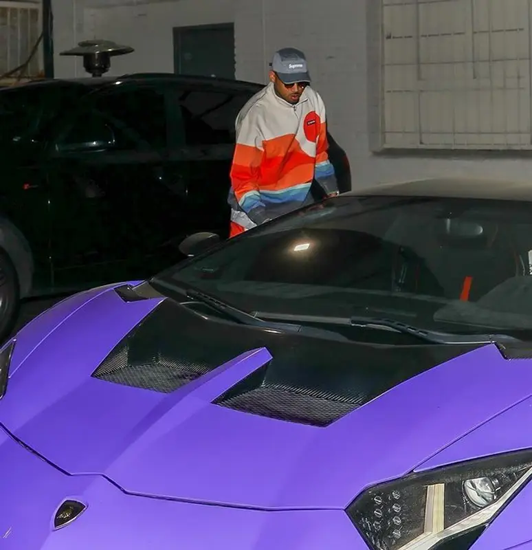 Chris Brown outfit in Kith, Supreme, and Columbia Sportswear, 2022