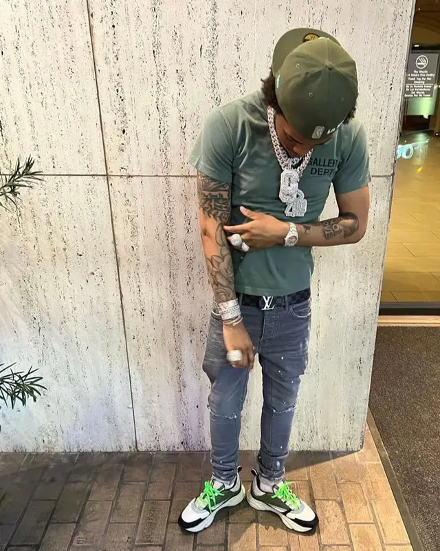Lil Migo outfit in Gallery Dept., Louis Vuitton, and New Era, 2022