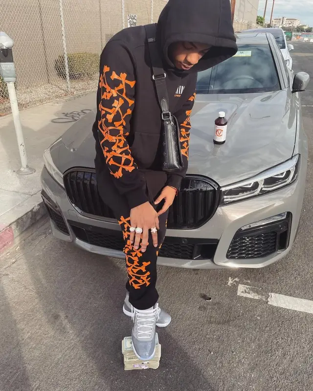 Dougie B outfit in Amiri, Jordan, and Louis Vuitton, 2022