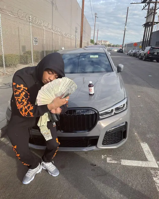 Dougie B outfit in Amiri, Jordan, and Louis Vuitton, 2022