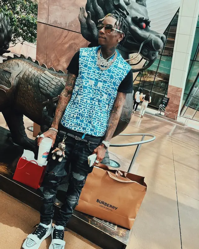 Soulja Boy outfit in Burberry, Amiri, and Versace, 2022
