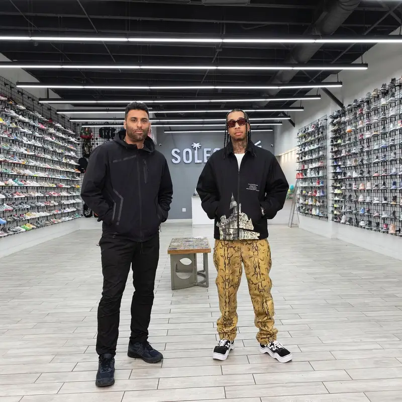 Tyga outfit in Undercover, Acne Studios, and Prada, 2022