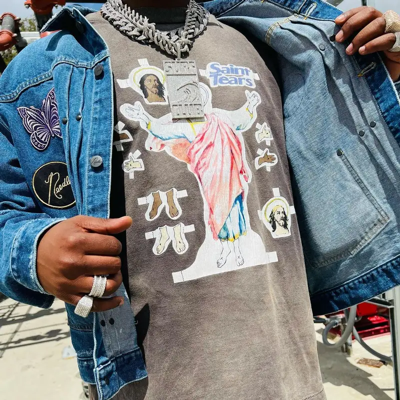 HitBoy outfit in Needles, Denim Tears, and Nike, 2022